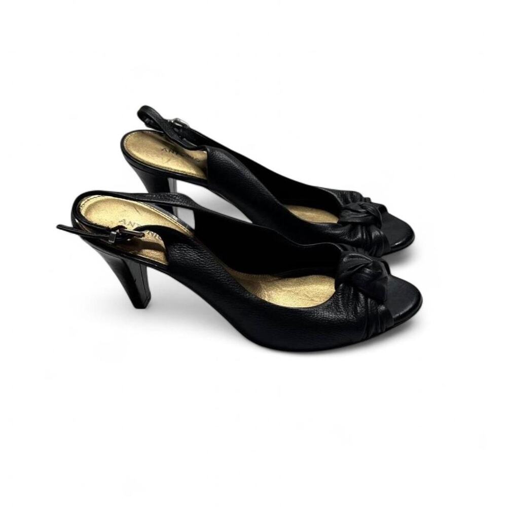 Black leather peep toe heels bow detail and adjustable size 6 .5 Antonio Malia